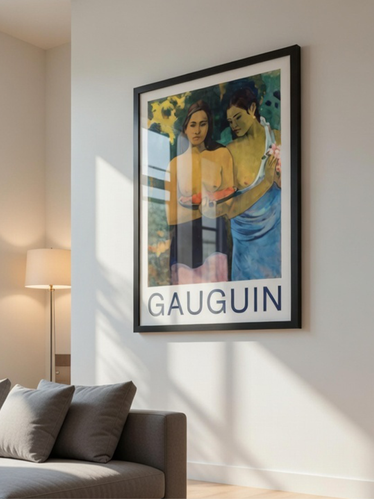 Large Gauguin art poster in a black frame on a modern living room wall with sharp window pane shadows.