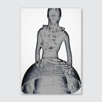 A black and white image of a sculpture or installation art piece, depicting a seated figure with a smooth, matte finish.