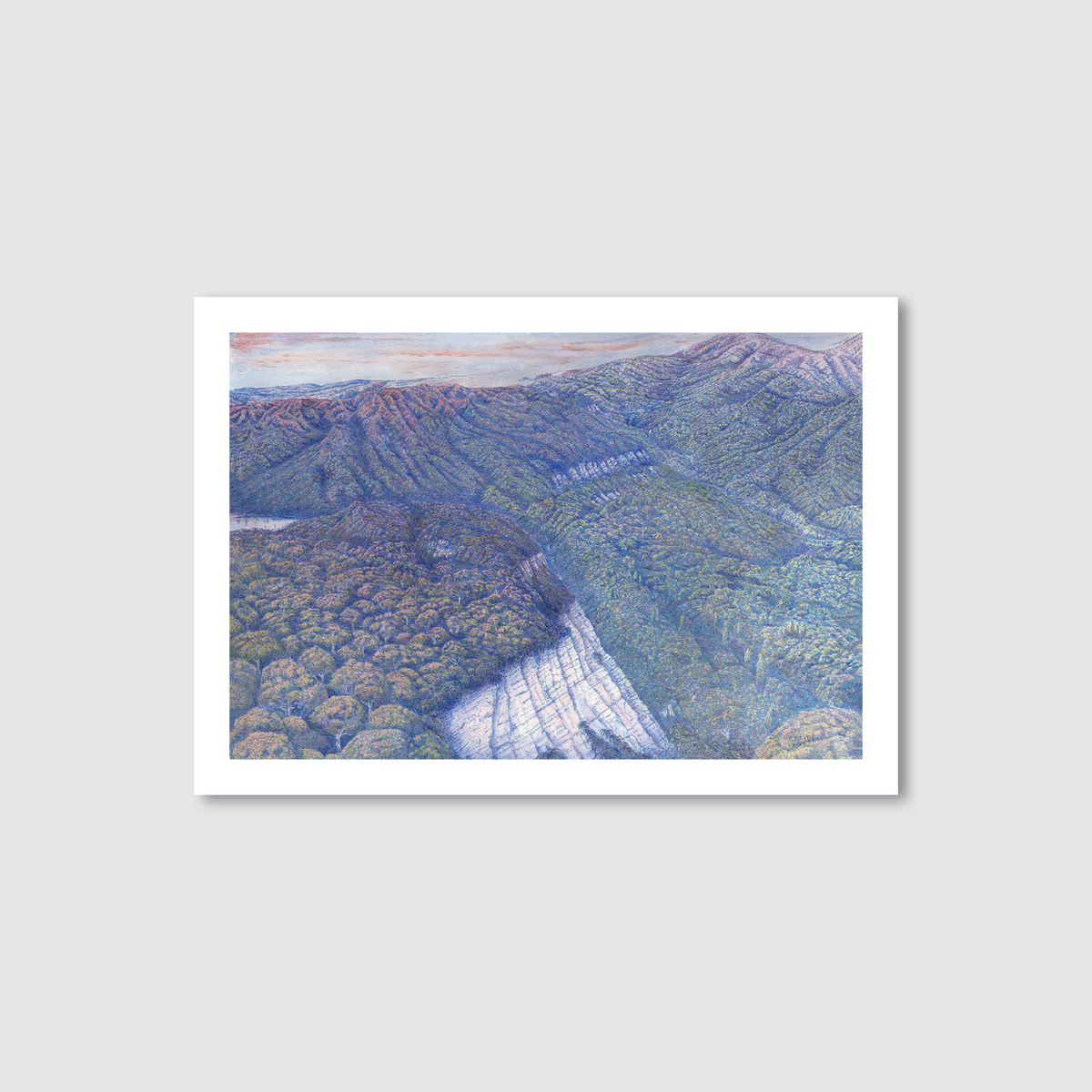 Framed artwork of a mountain landscape with a river on a light gray background