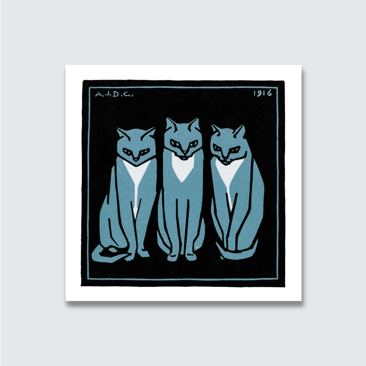 Framed artwork of three stylized cats in blue on a black background
